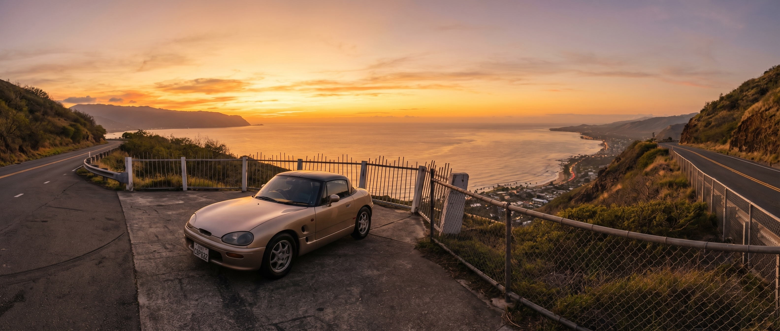 Sports car at golden hour on a scenic coastal overlook